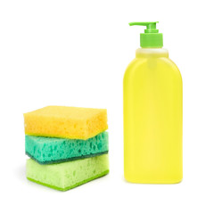 Bright colored sponges and a plastic bottle of liquid for cleaning the bathroom, washing dishes and other household appliances. Isolated. Close-up