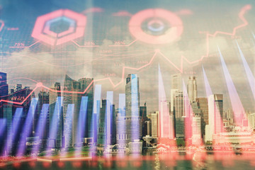 Forex chart on cityscape with skyscrapers wallpaper multi exposure. Financial research concept.