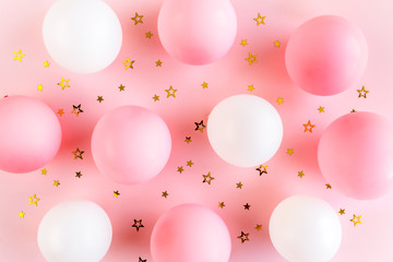 Balloons and confetti on pink background. Valentines day, Birthday, holiday concept. Flat lay, top view