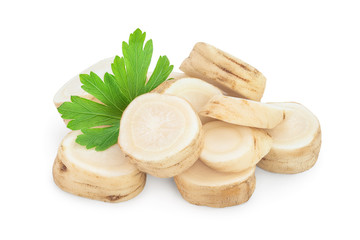 Parsley root slices and leaves isolated on white background