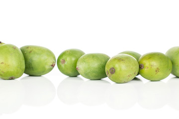 Lot of whole hardy green kiwi isolated on white background