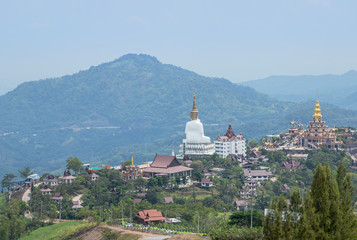 Landscape view public of big white Buddha statue at Wat Phra That Pha Son Kaew Temple with  mountain view background at Khao Kho, Phetchabun ,Thailand.