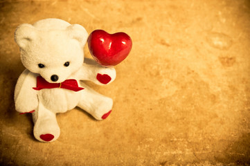 toy - a white teddy bear with red heart like love background with copy space  © starblue