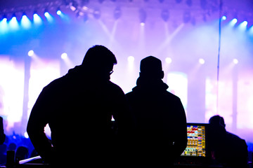 Sound and lighting engineer at an outdoor festival concert
