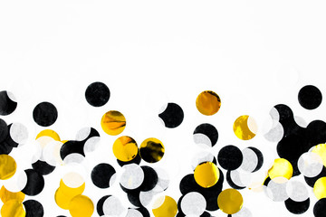 Colorful paper confetti on white background. Celebration concept. Flat lay. Top view.