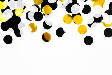 Colorful paper confetti on white background. Celebration concept. Flat lay. Top view.