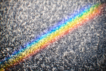 Colors of the rainbow on a morning frosted surface of fractal cristals,  the spectrum of the light...