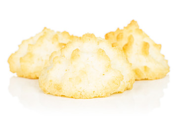 Group of three whole homemade golden coconut biscuit isolated on white background