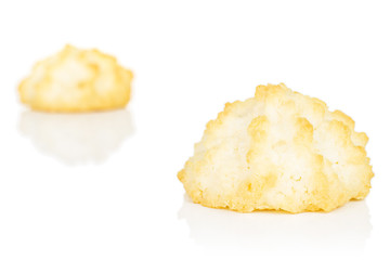 Group of two whole homemade golden coconut biscuit isolated on white background