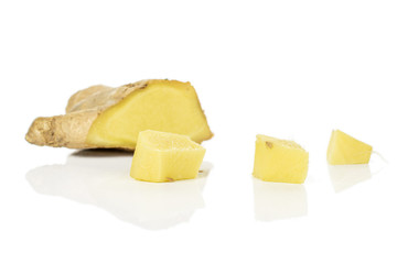 Group of four pieces of fresh brown ginger isolated on white background