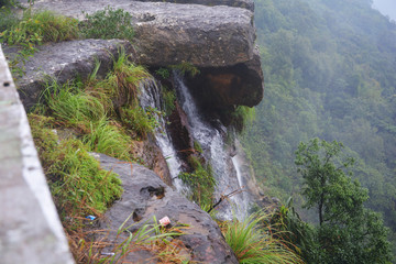 Close up of  the water falls of Cherrapunjee Eco park with lots of trees and greenery of the hills,...