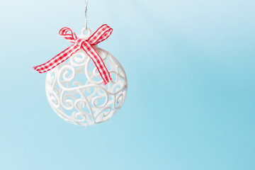 christmas ball on blue background, copy space. winter celebration card