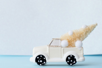 christmas car with fir tree on white background, copy space. winter new year card