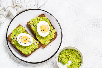 Avocado Sandwiches on white background.