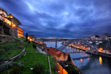 PORTO, PORTUGAL. The Dom Luis I bridge over river Douro. To the right (north) the city of Porto, to the left (south), Vila Nova de Gaia.