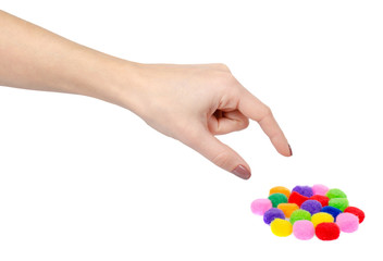 Colored pom pom, party and sewing decoration. Isolated on white.