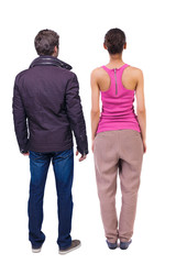 Fototapeta premium Back view of couple. beautiful friendly girl and guy together.
