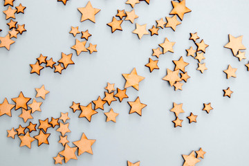 Wooden stars on a blue background as concept of the starry sky
