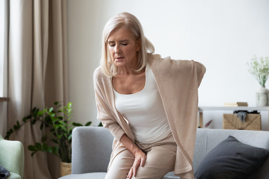 Elderly 60s Woman Suffer From Back Ache