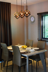 dish ware sets arrange on dining table inside eating room of modern home interior