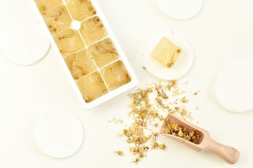 Chamomile tea ice cubes for skin treatment.