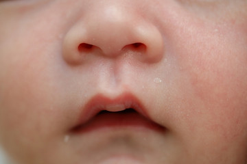 close up mouth and nose newborn baby softness sensitive skin