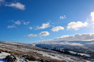 Winter mountain landscape with mountains and blue sky