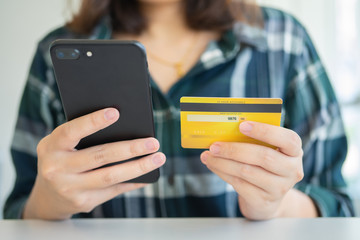 Online shopping with smartphone and shopping bags delivery service using as background shopping concept and delivery service concept with copy space  for your text or  design.