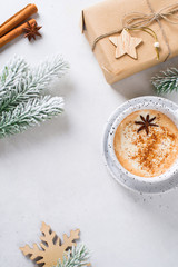 Obraz na płótnie Canvas Winter holidays card with cup of coffe, pine, fir and cinnamon