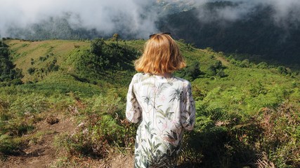 girl looking at the mountains, landscape sky