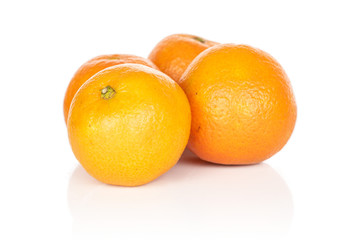 Group of four whole fresh orange mandarin isolated on white background