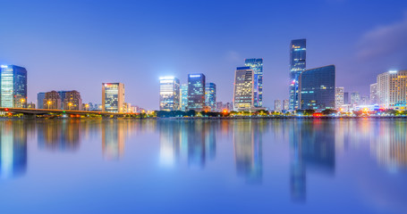 Fototapeta premium Night view of modern office building in Fuzhou Financial District..