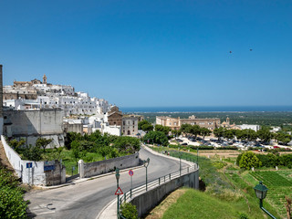 Fototapeta premium the white old town of the mountain village, Ostuni, Apulia, Southern Italy, June 2019