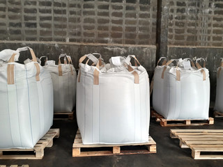 Urea Stock pile jumbo-bag in warehouse waiting for shipment.Put on wooden pallets