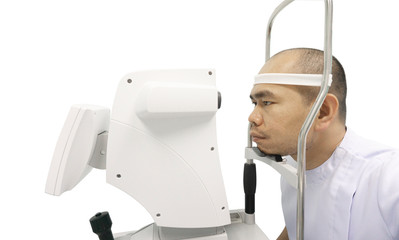 Asain man patient checking vision with  Intraocular lens measurement