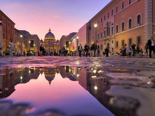 Wonderful view of St Peter Cathedral, Vatican, Rome, Italy. Sunset sky with night city lights