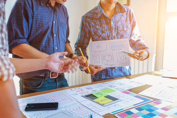 Soft Focus,A team of UI / UX web designers are working together to develop a mobile responsive...