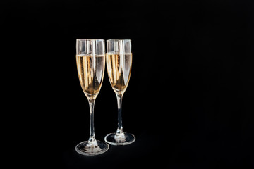 Happy New Year concept, two glasses of champagne on black background. Merry christmas.