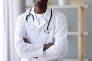 Close up cropped image young smiling professional african american doctor.