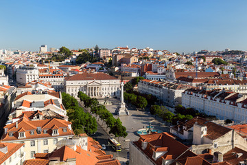 Fototapeta na wymiar View of the Rossio Square (Praca do Rossio) in the Baixa district and beyond from above in Lisbon, Portugal, on a sunny day.