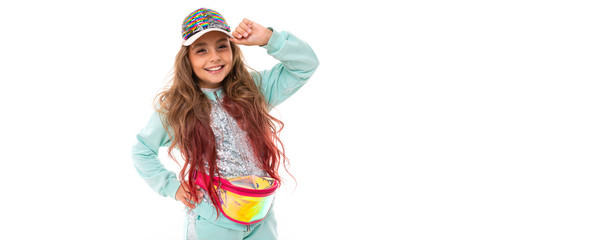 Panorama little pretty caucasian girl in a tracksuit isolated on white background