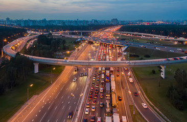 View from the air on the movement of cars on the overpasses at the intersection with the ring road...