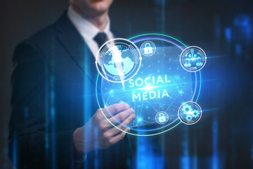 Business, Technology, Internet and network concept. Young businessman working on a virtual screen of the future and sees the inscription: Social media