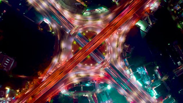 Aerial drone timelapse motion hyperlapse at night with cars and traffic.
