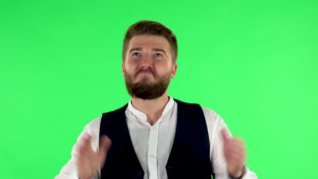 Man claps his hands with wow happy joy and delight. Green screen