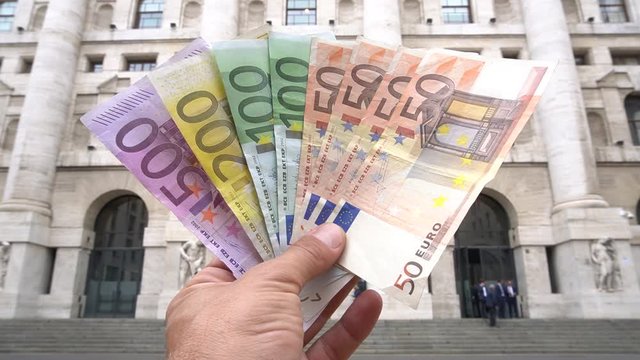 Italy, Milan 24 September 2019 , Euros - Money - euro cash background. Euro Money Banknotes - tangent policy, cash back ,Piazza affari home of the Italian stock exchange