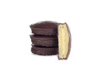 pile of chocolate covered sponge cakes with custard cream filling