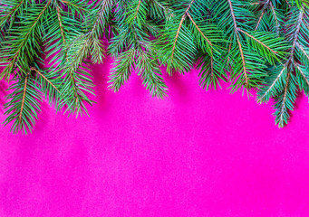 Christmas and New Year theme decorated background, top view, with Christmas tree branches and ornaments