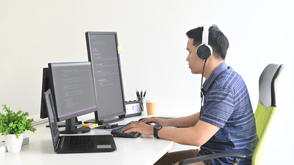 Professional programmer working in his  programming website coding computer.