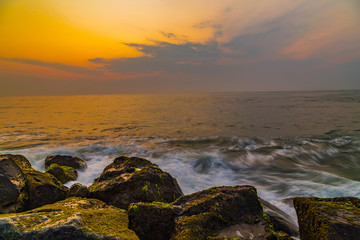 storm waves are breaking about the breakwater